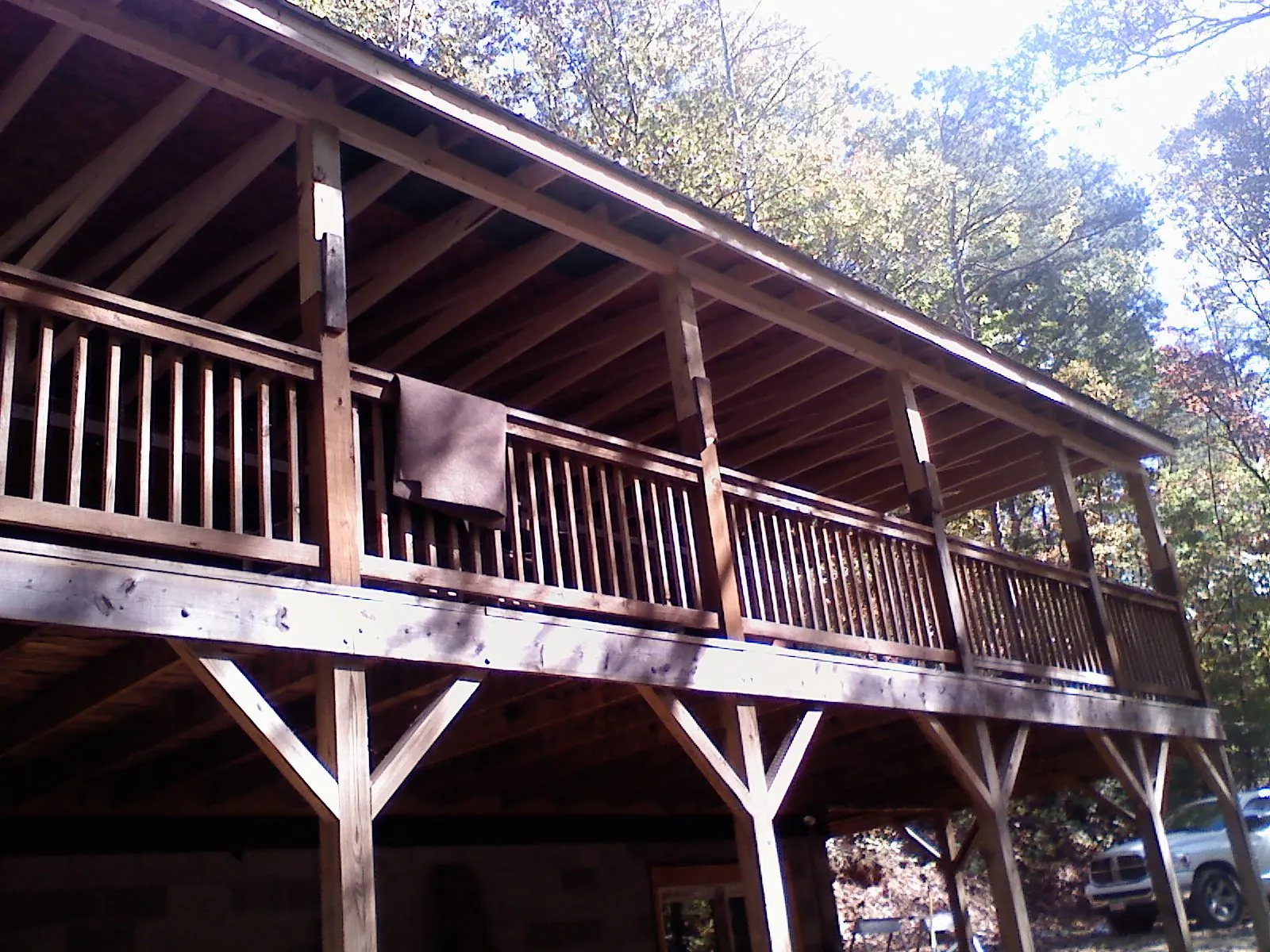 Timber framing under a new elevated porch and deck — Roof Leak Repair in Ann Arbor by Roofing Brothers